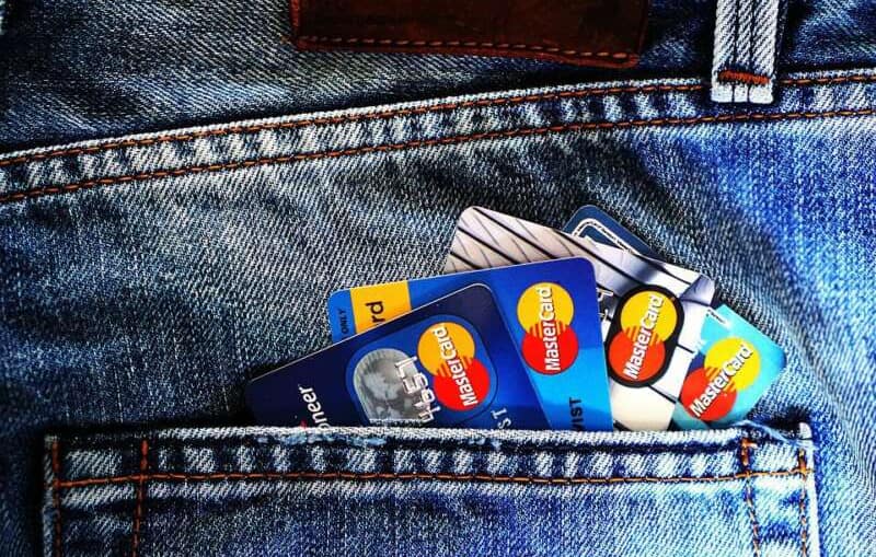 multiple canadian credit cards in a jeans back pocket