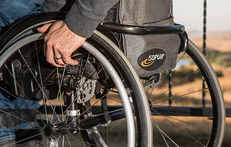 person in a wheelchair, representing